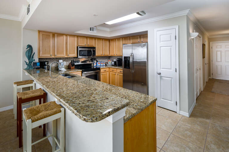 3 barstools for quick meals at the kitchen bar area