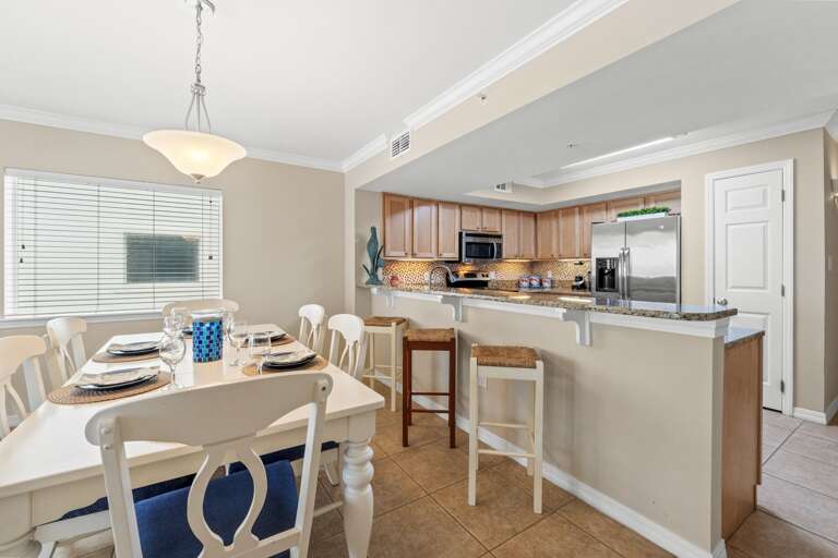 Seating for 6 at the table with 3 bar stools at the breakfast bar.