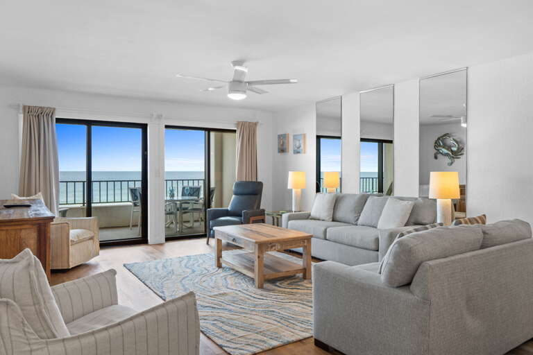Living Room Oasis: Revel in stunning ocean views from stylish seating and modern décor!