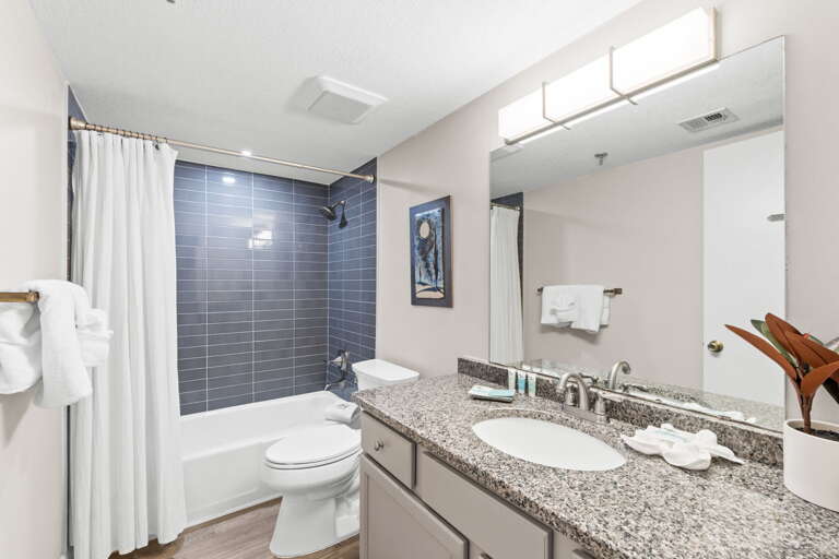 The bathroom has a tub and shower combination. 