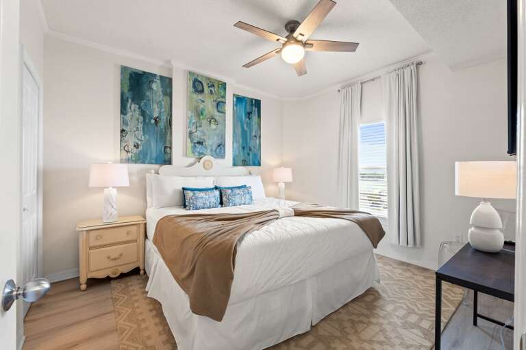 A queen size bed in the guest room.