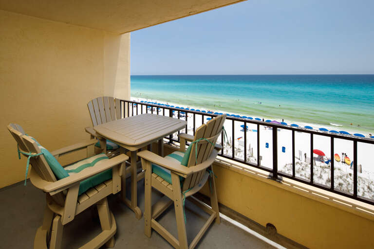 Step onto the balcony and take in sweeping ocean views just steps from the sand.