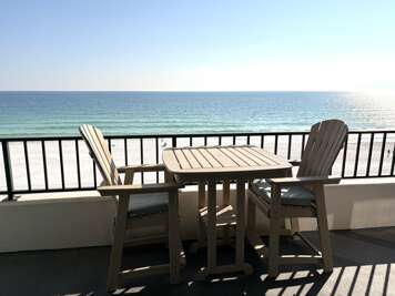 Step onto the balcony and take in sweeping ocean views just steps from the sand.