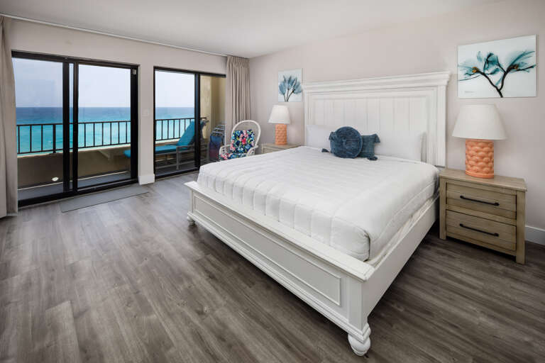 Inviting master bedroom with a king-size bed and easy access to the balcony.