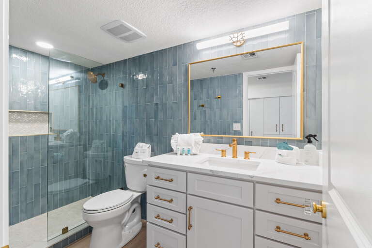 The master bathroom features a spacious walk-in shower.