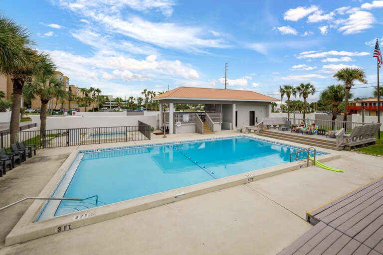 The pool features a floating rope with buoys to designate the shallow and deep areas