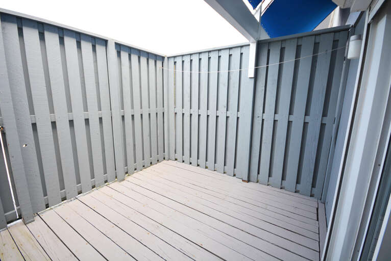 Rear Enclosed Deck Behind Dining Area