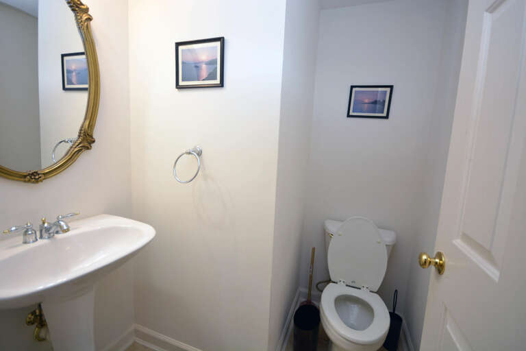 Half Bath located off Living/Kitchen Area