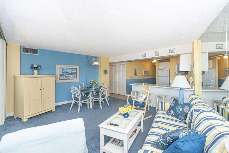 Blue And Beige Beach-theme Living Area In A Vacation Rental