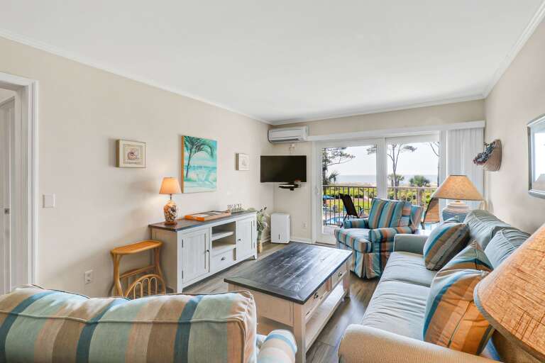 Enjoy all the natural light from the sliding glass door  and oceanfront view!