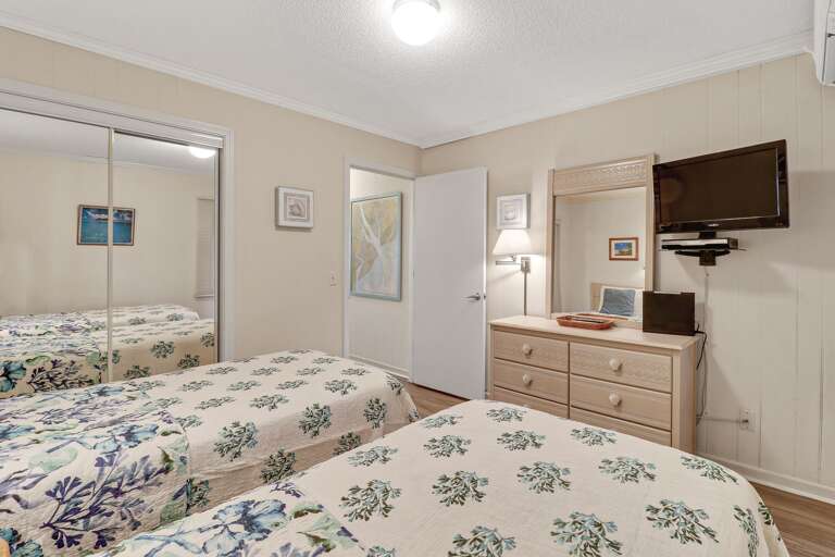 Two twin beds are in the guest bedroom.