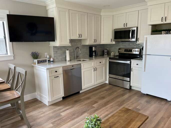 Plenty of storage in this well equipped kitchen with new appliances and standard coffeemaker.  