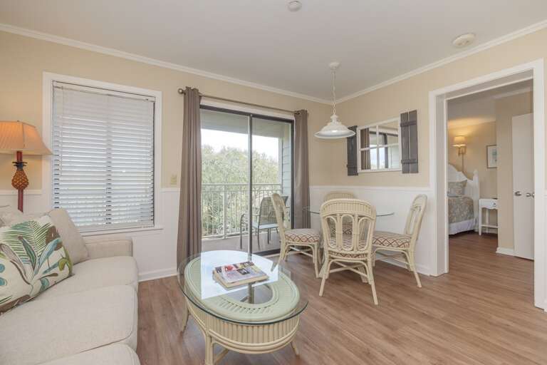 Living/Dining area leads to lovely balcony with sliding glass door.  