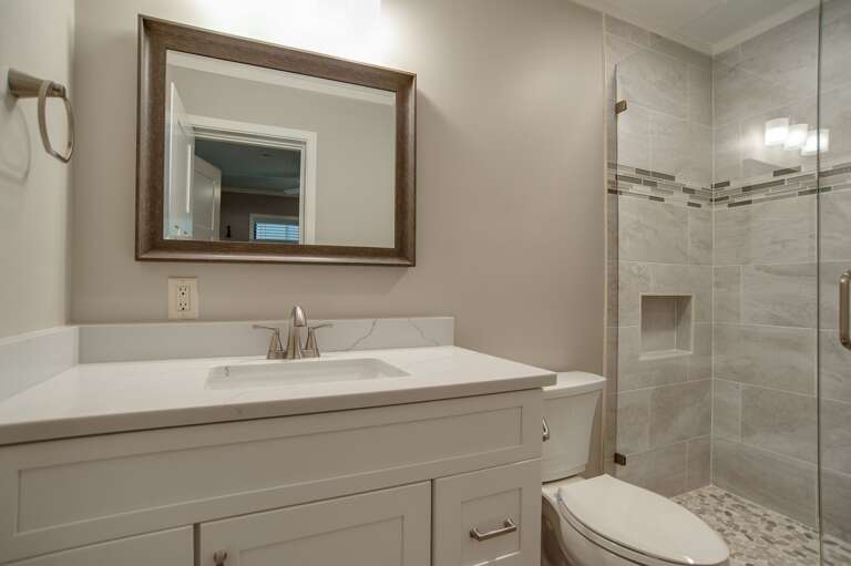 Updated bathroom with tiled walk-in shower.   Updated bathroom with tiled walk-in shower.