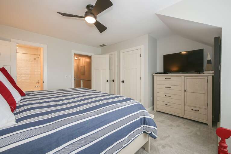 Comfortable bedding & ceiling fan makes for a comfortable night's sleep.