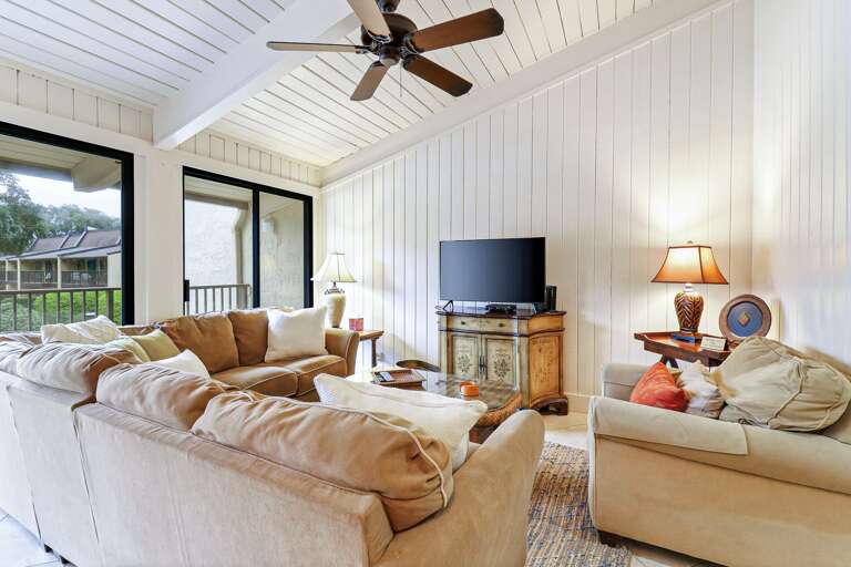 Living Area With Sofas And TV In Vacation Rental