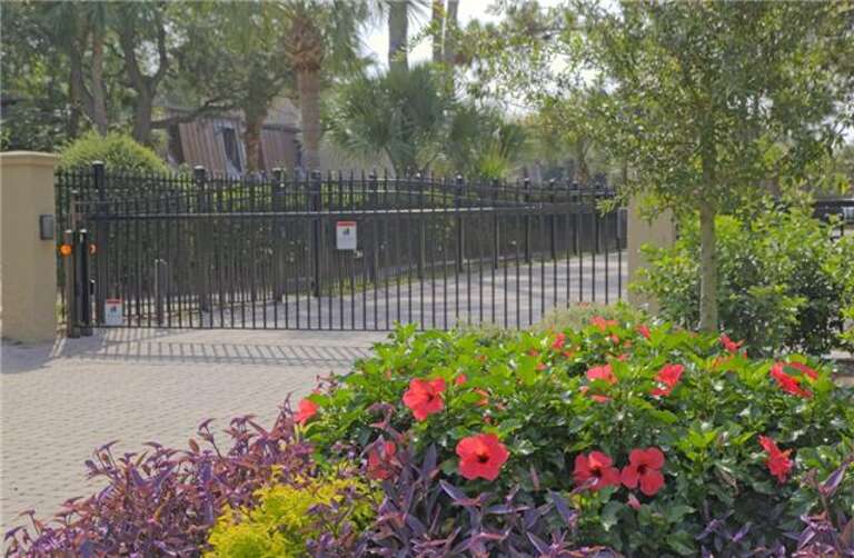 The gated entry to the Hilton Head Beach Villa complex provides  security and  privacy that is sure to please each visitor. Lush landscaping gives a sense of  beauty color and tranquility to the property.