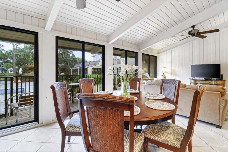 Kitchen table with view to the deck/pool. Great space to share with the family