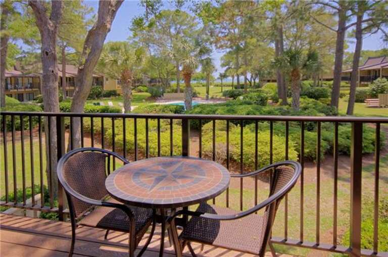 The Oceanview balcony from this Deluxe Hilton Head Beach Villa #16 has views across the courtyard to the pool and the Atlantic Ocean beyond; a most enjoyable spot for morning coffee and your newspaper or a light lunch.