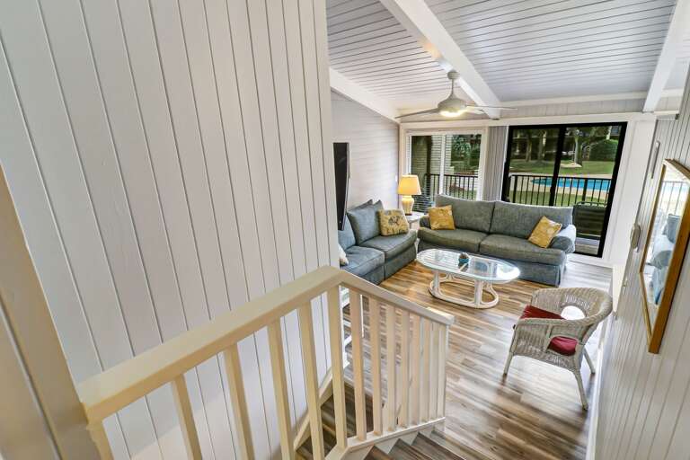 Upstairs view of the living room and courtyard pool.