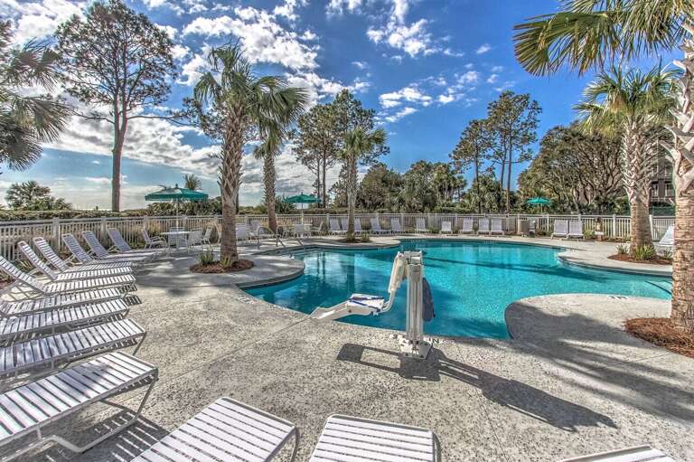 Here’s the new Beachfront pool completed in 2015 with handicap lift. . Beautiful palm trees, tables with seating and umbrellas to relax and enjoy a view of the amazing Atlantic Ocean waves.