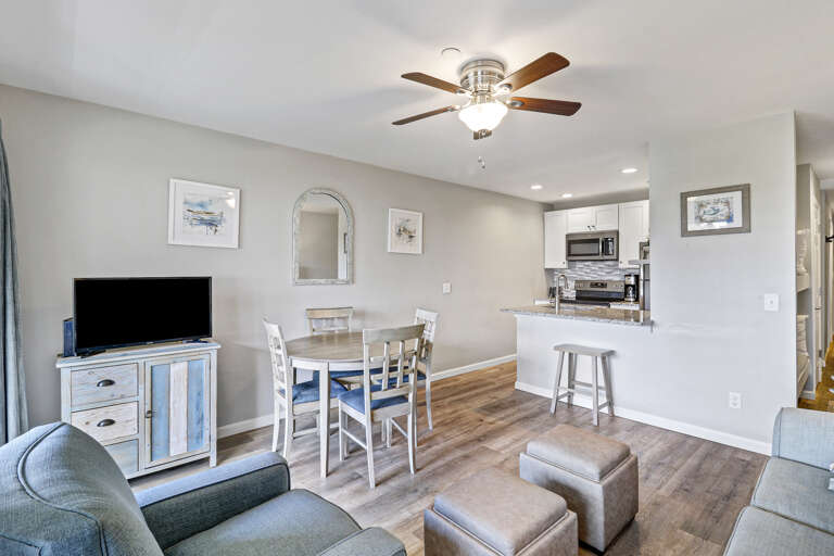 Just steps from the living area, our bright and inviting dining space offers the perfect setting for shared meals and moments of relaxation. The elegant dining table comfortably seats 4 guests and is framed by wide windows that showcase sweeping views of 