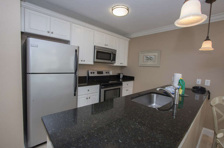 The newly renovated completely furnished Kitchen features all stainless steel appliances, beautiful granite counters .