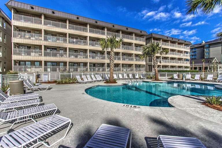 Here’s the new Beachfront pool completed in 2015 with handicap lift . Beautiful palm trees ,tables with seating and umbrellas to relax and enjoy a view of the amazing Atlantic ocean waves.