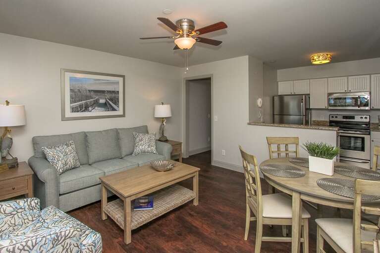 The newly renovated completely furnished Kitchen features all stainless steel appliances, beautiful granite counters.  Dining table seats four. The living room has a comfy sofa bed, wall mounted smart flat screen T.V. and sliding door to balcony with amaz