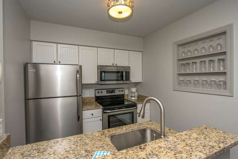 The newly renovated completely furnished Kitchen features all stainless steel appliances, beautiful granite counters 