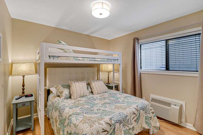 Plenty of space for 3 people in this guest bedroom with queen sized bed and lofted twin.  Individual A/C unit will keep you cool.   