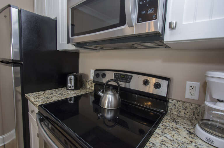 The newly renovated Kitchen / Dining Area features all stainless appliances, granite counters.