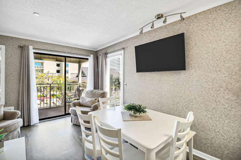 Interior Living Space With Dining Table And Television