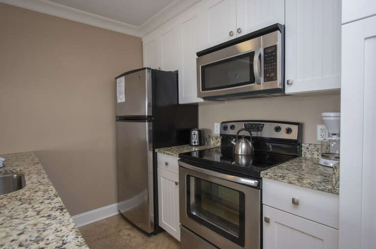 The newly renovated completely furnished Kitchen features all stainless steel appliances, beautiful granite counters and dining bar seating for four . 