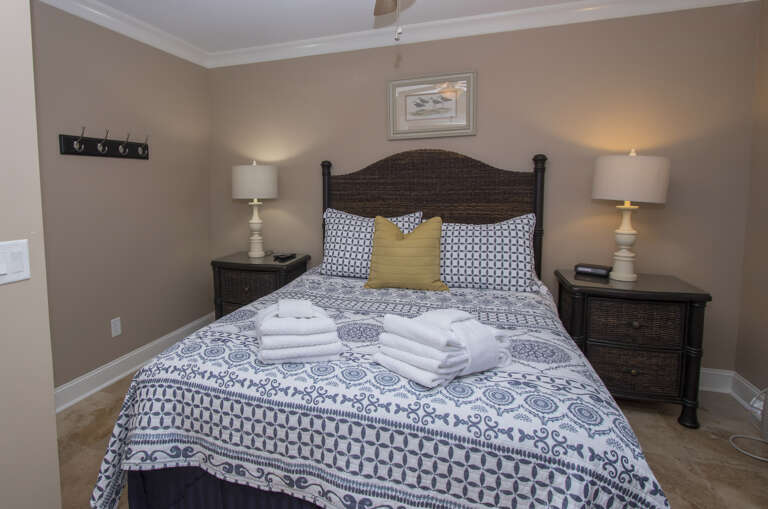 Master Bedroom fully furnished in Ocean Dunes features a Queen sized bed, Smart flat screen T.V, closet space .