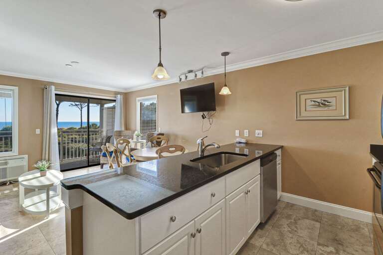 Kitchen view of the ocean and swimming pool.