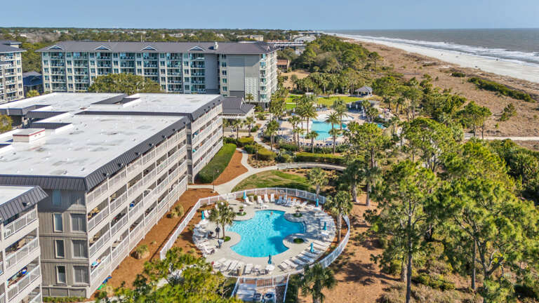 Aerial View Of Beachfront Vacation Rental Complex With Pool Aerial View Of Beachfront Vacation Rental Complex With Pool