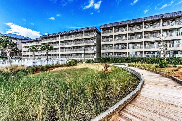 Walkway to Ocean Dunes oceanfront building.