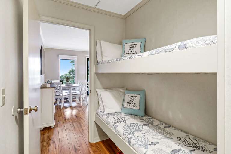 Hallway area counts with two bunk beds, perfect for children.