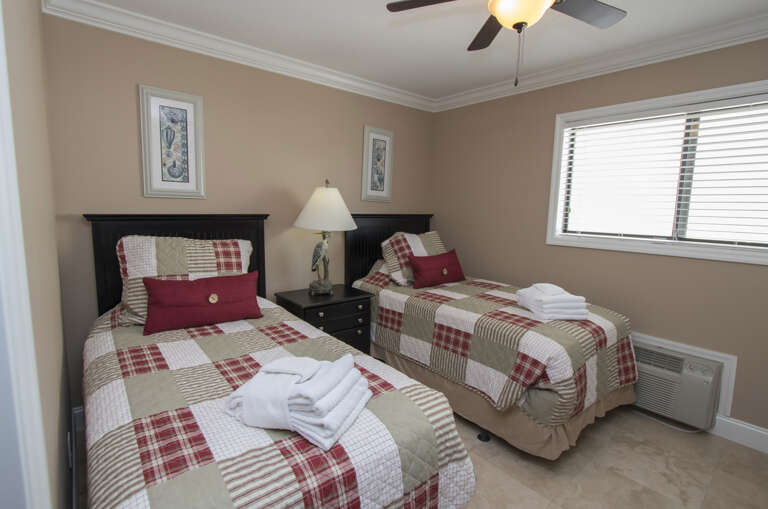 Fresh new look for Twin beds in guest bedroom.