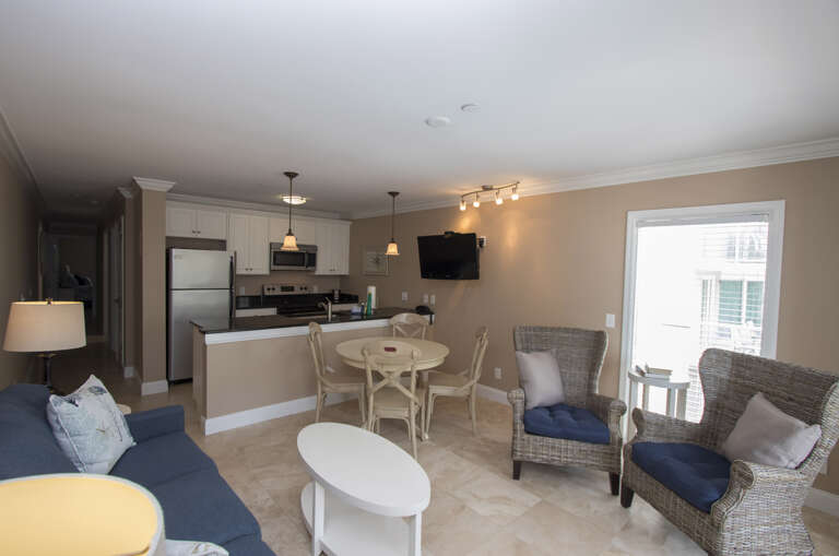 The Living Room Area has sliding door access to the Ocean view Balcony. Upscale furnishings and a wall mounted flat screen television complete the space.