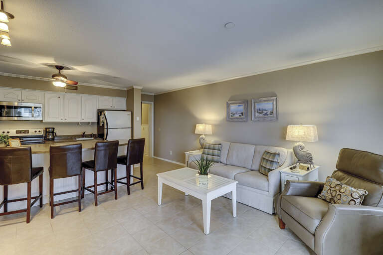 The living room area has a sleep sofa with upscale furnishings.   