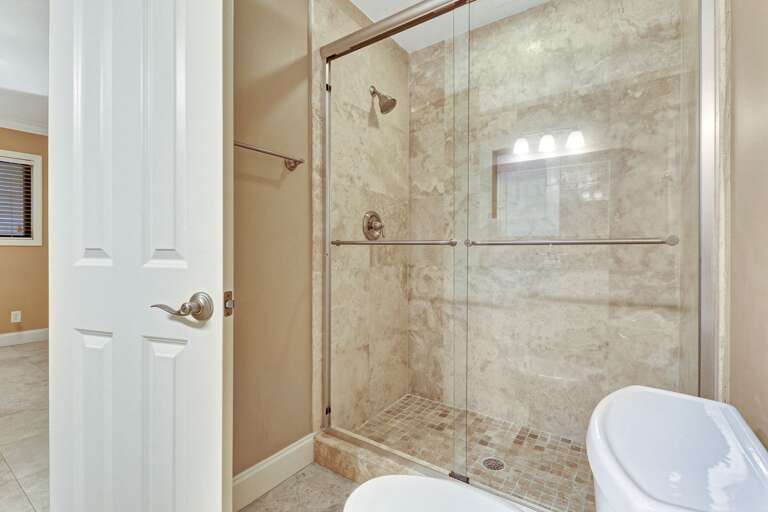 Beautiful, large walk-in tiled shower in master bathroom.