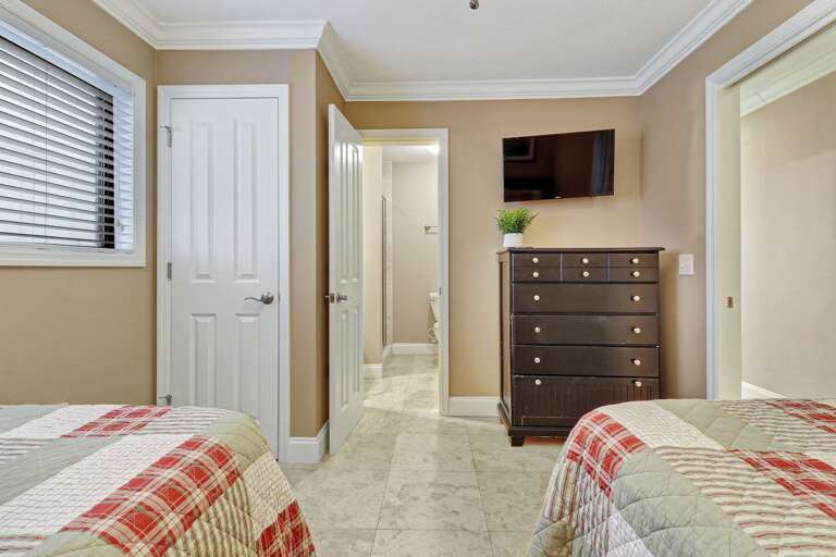 2 twin beds with connecting bathroom.  Plenty of storage and mounted flat screen TV. 