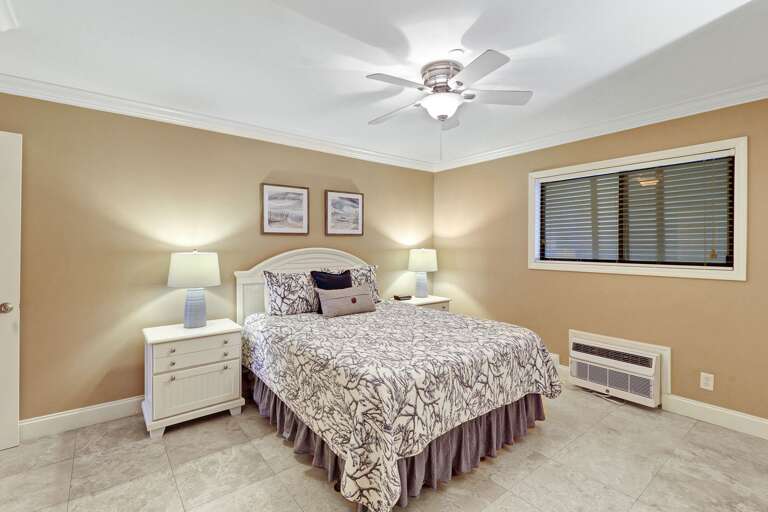 Ceiling fan and individual A/C unit will keep this bedroom comfortable all year long.  