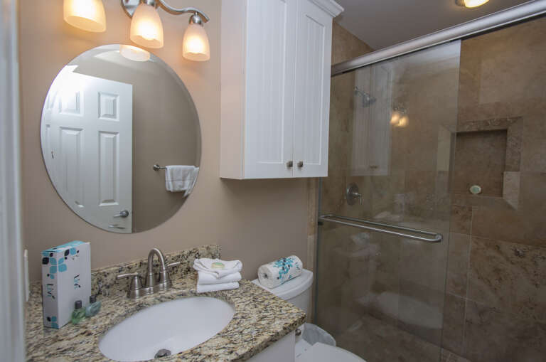 The all marble walk in shower in the Master Bathroom is a true delight with a granite counter top.