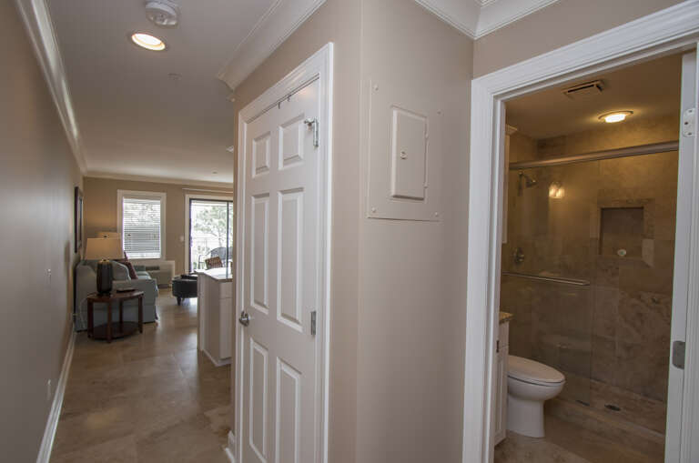The hallway that leads to the living room with an oceanfront view.