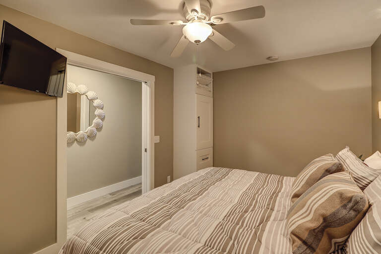 King sized bedroom has plenty of storage and flat screen TV along with ceiling fan and A?C unit. 
 King sized bedroom has plenty of storage and flat screen TV along with ceiling fan and A?C unit.