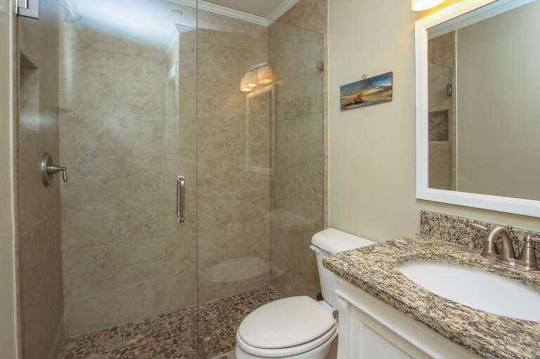 The vanity/sink in the Master Bath is topped with the same granite as found in the kitchen. 
The all marble shower in the Master Bathroom is a true delight

