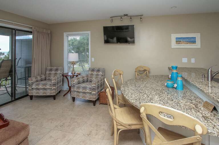 The newly renovated Kitchen / Dining Area features all stainless appliances, granite counters and dining bar having seating for four, and tile flooring throughout.

